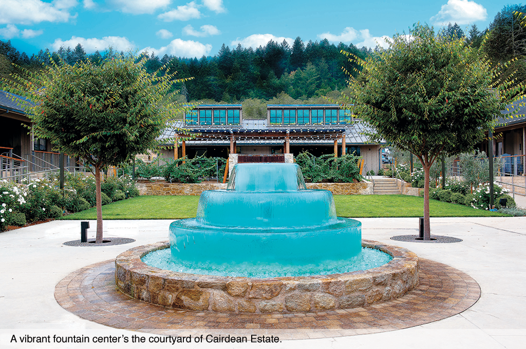 A vibrant fountain center's the courtyard of Cairdean Estate.