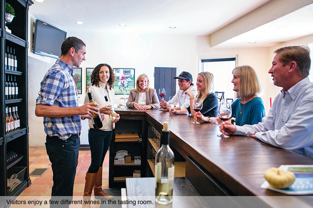 Visitors enjoy a few different wines in the tasting room.