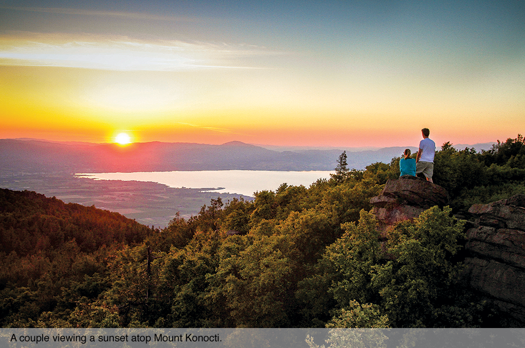 A couple viewing a sunset atop Mount Konocti.